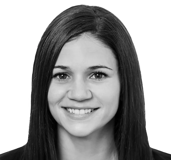 a black and white photo of a smiling woman