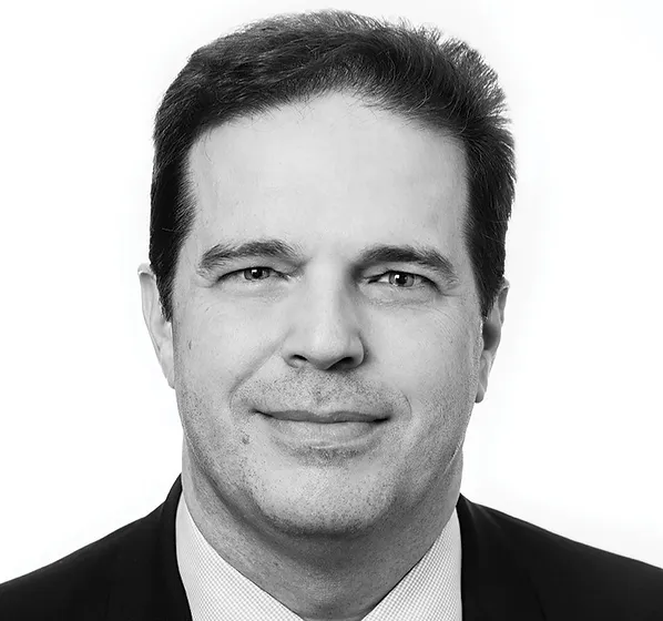 a black and white photo of a man in a suit