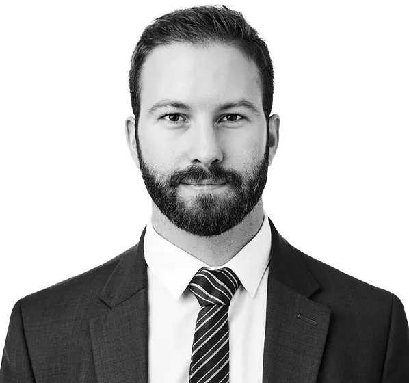 a man in a suit and tie posing for a picture