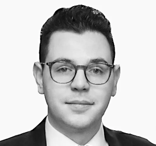 a black and white photo of a man wearing glasses